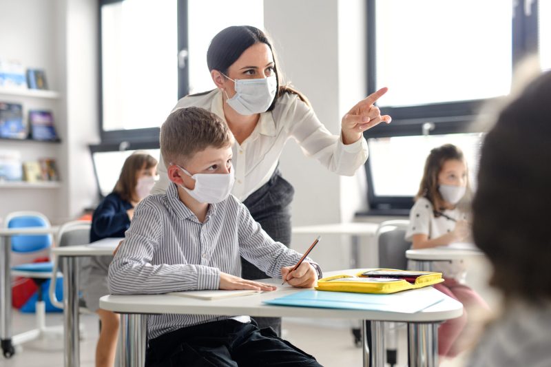Teacher,And,Children,With,Face,Mask,Back,At,School,After